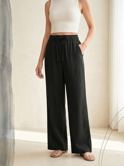 Linen-Feel Wide-Leg Drawstring Pants in Black, worn by a model