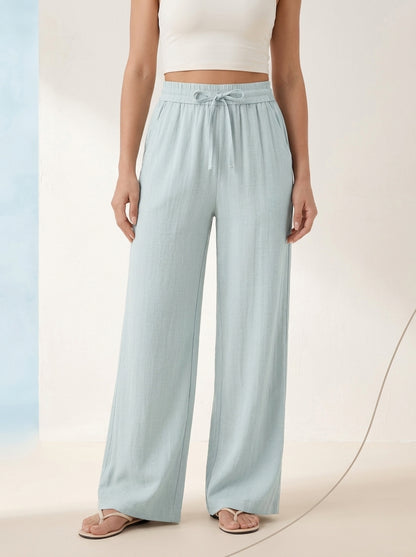 Linen-Feel Wide-Leg Drawstring Pants in Delicate Blue, worn by a model