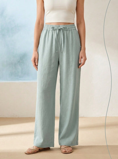 Linen-Feel Wide-Leg Drawstring Pants in Ether, worn by a model