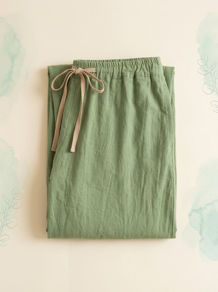 Cotton-Linen Drawstring Pants with Pockets in Light Green, folded flat