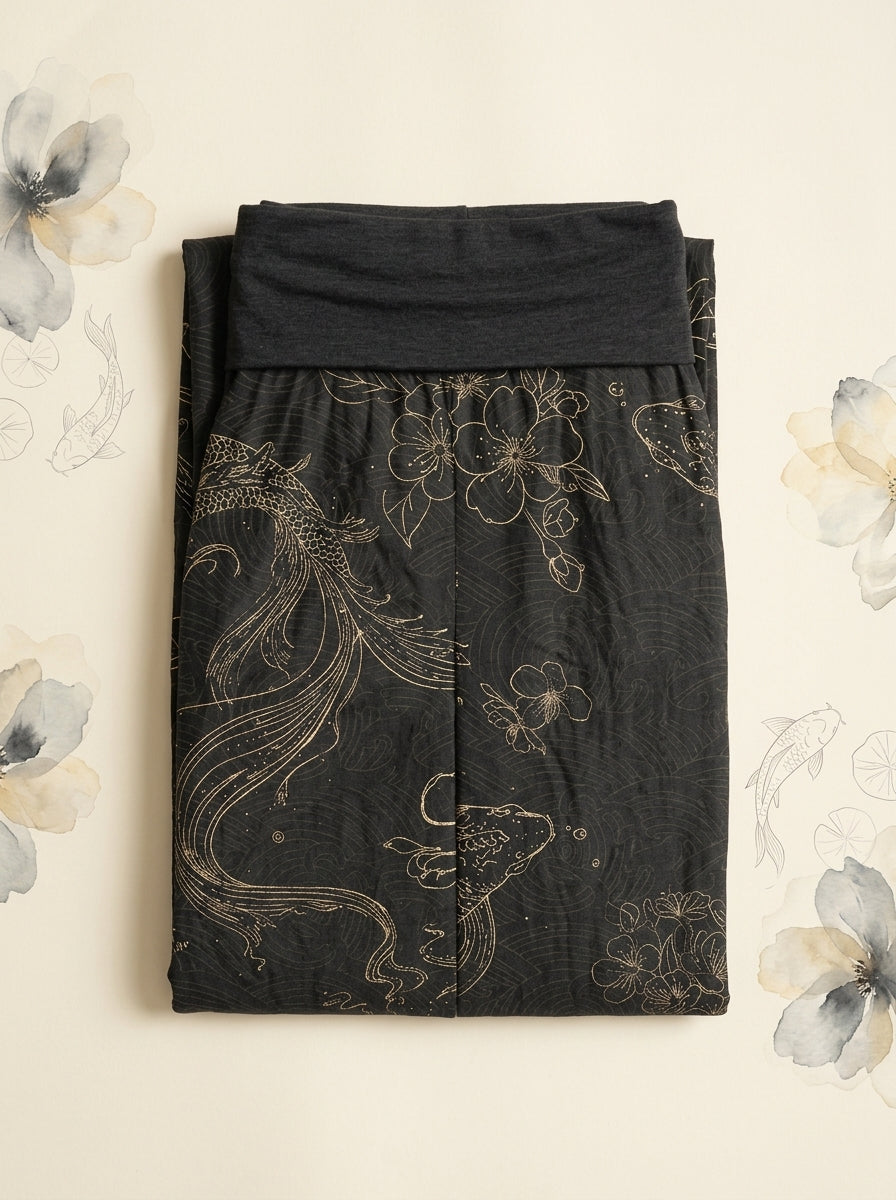 Koi Floral Cotton Harem Pants in Black, folded flat