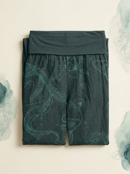 Koi Floral Cotton Harem Pants in Dark Cyan, folded flat