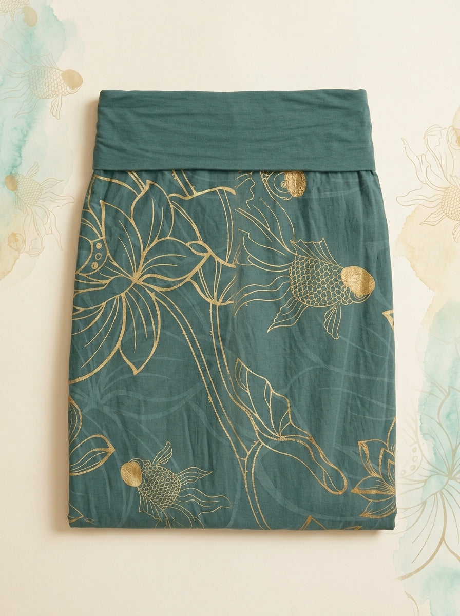 Koi & Lotus Cotton Harem Pants in Dark Cyan, folded flat