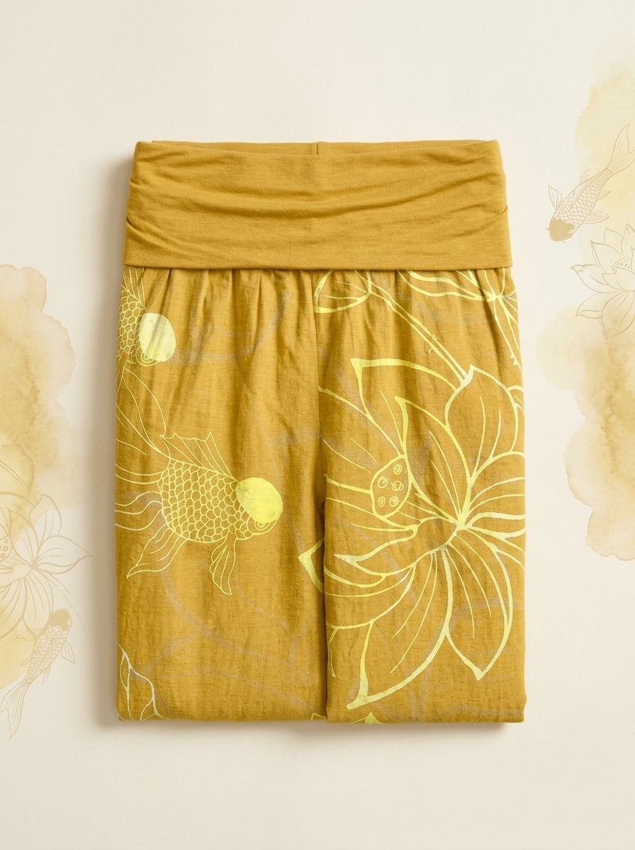 Koi & Lotus Cotton Harem Pants in Gold, folded flat