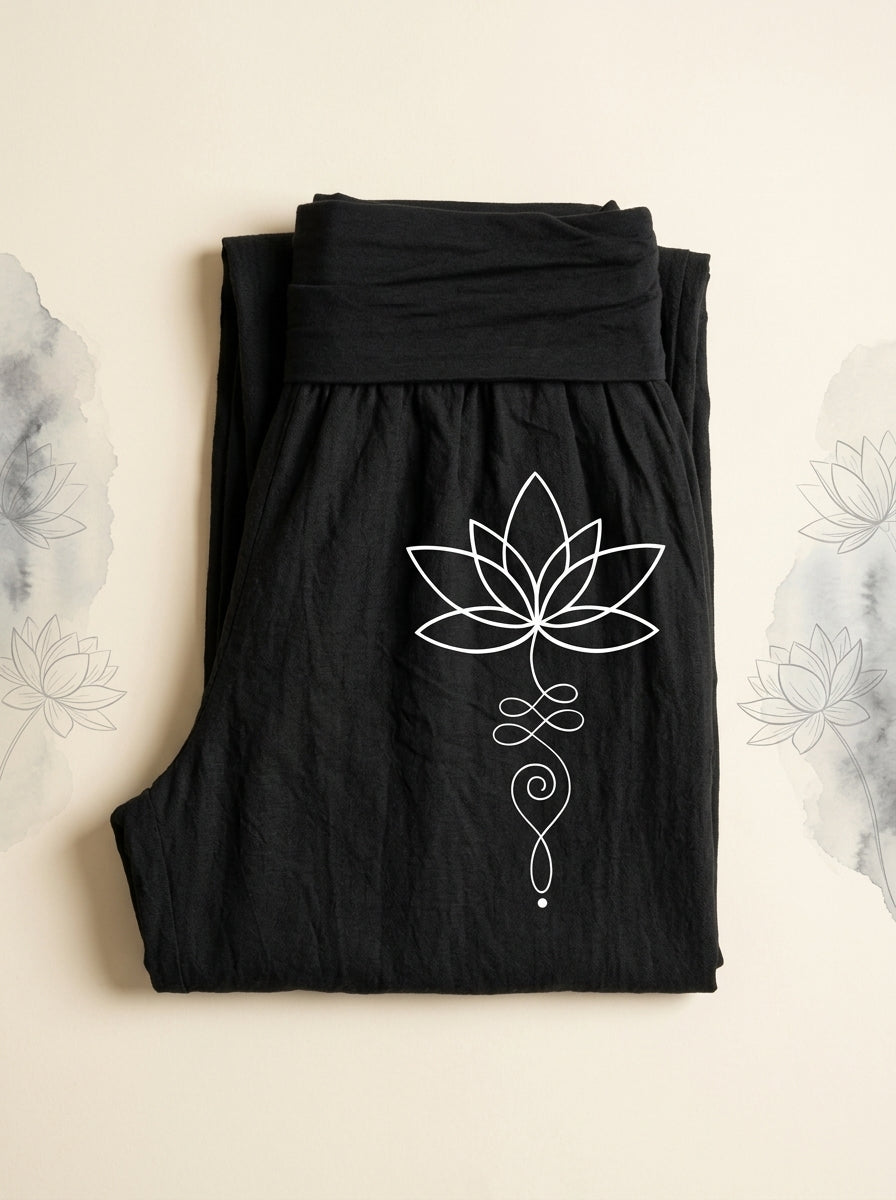 Lotus Unalome Cotton Harem Pants in Black, folded flat