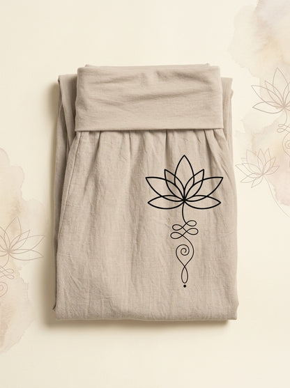 Lotus Unalome Cotton Harem Pants in Tan, folded flat