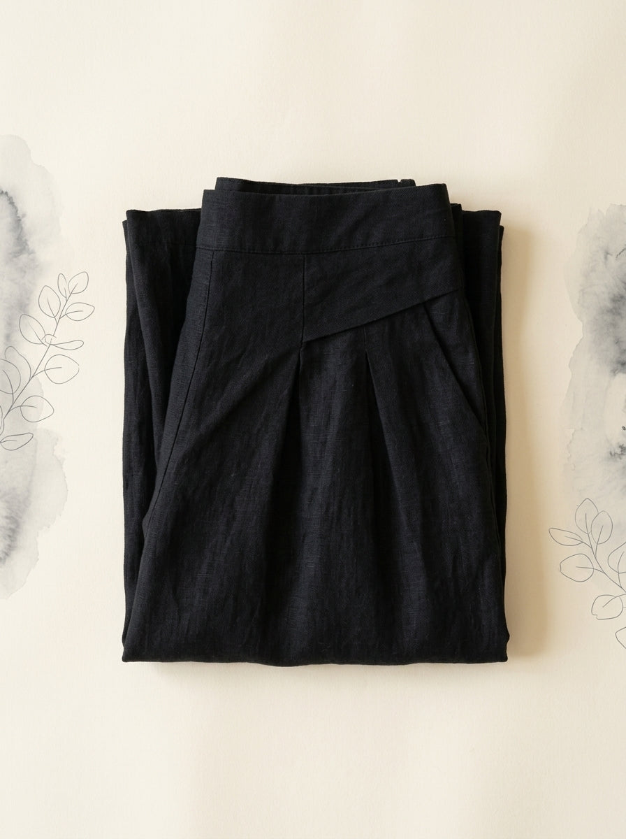 Cotton-Linen Wide-Leg Pants with Pockets in Black, folded flat